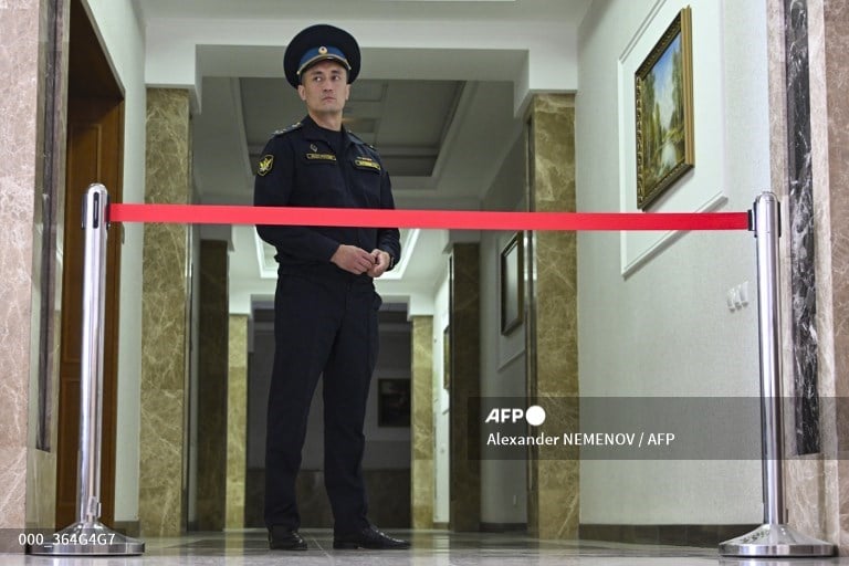 A court bailiff blocks a hallway of the Sverdlovsk Regional Court during a hearing in the trial of US journalist Evan Gershkovich, accused of espionage, in Yekaterinburg on July 18, 2024.